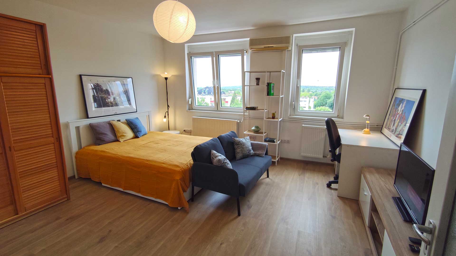 A képen, a 19,70 m2 alapterületű lakószoba látható.